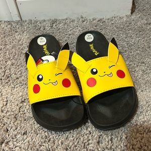 Pokémon Pikachu Groundup slides. Kids size 4/5. Brand new with tags.